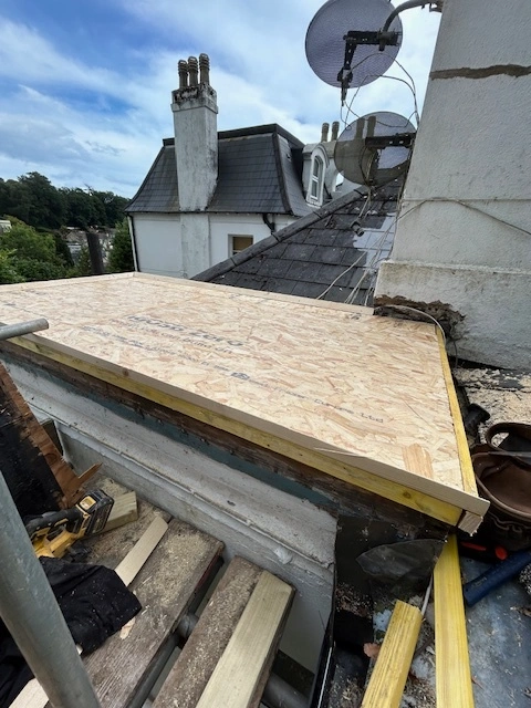 A new OSB3 timber deck being installed on a flat roof structure in Torbay.