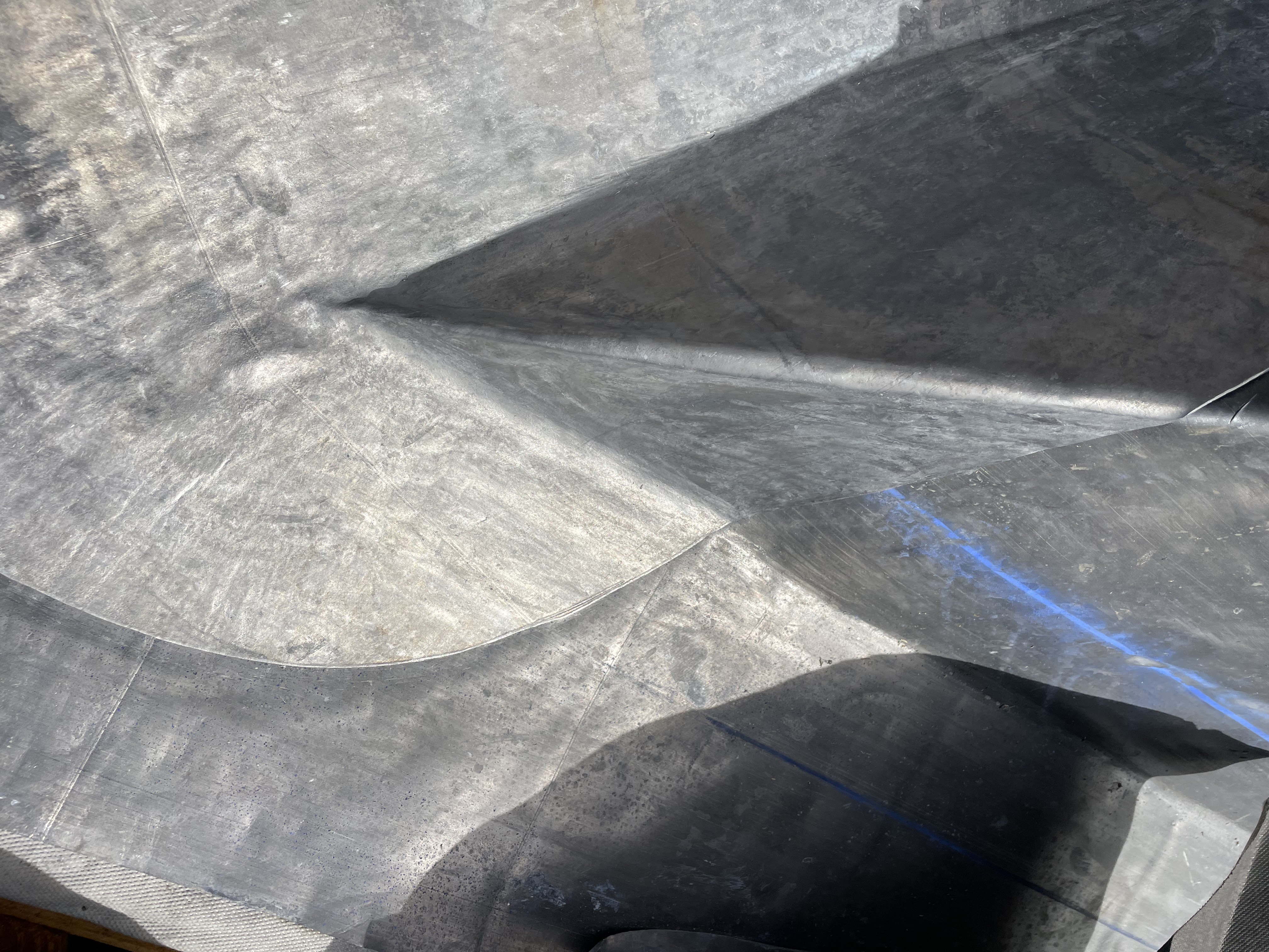 A fully Bossed Valley Saddle In Plymouth, showcasing leadwork expertise.